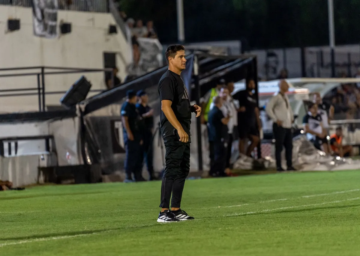 soccer coach on the sidelines