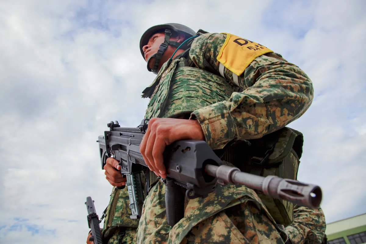 armed man with rifle