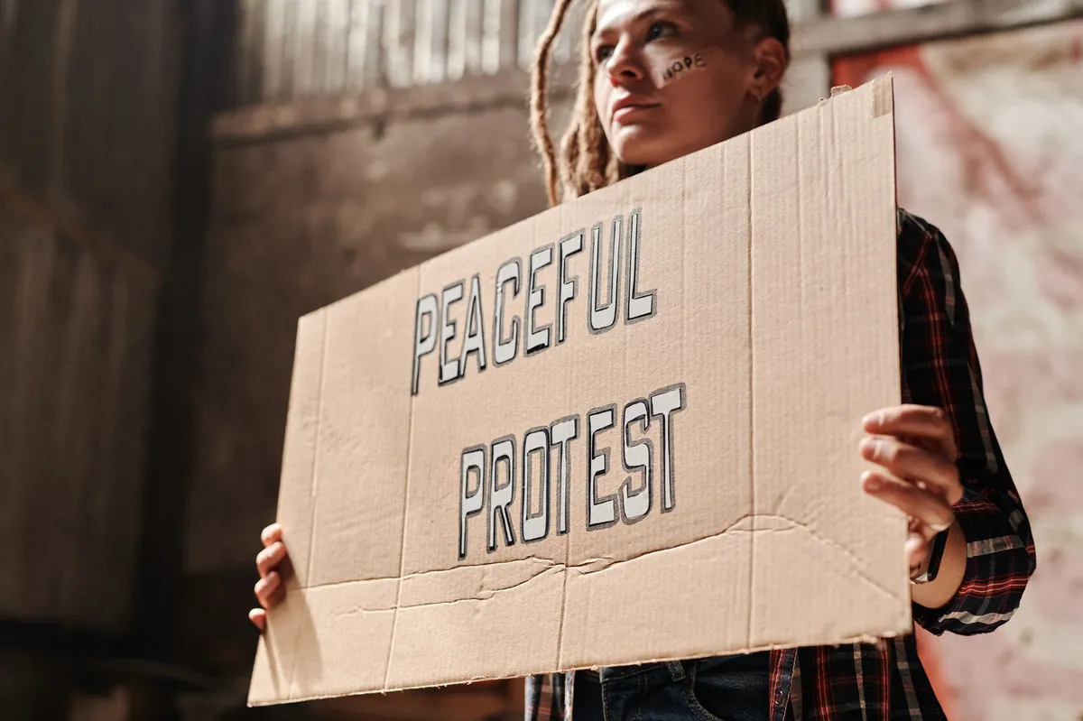protester holding sign