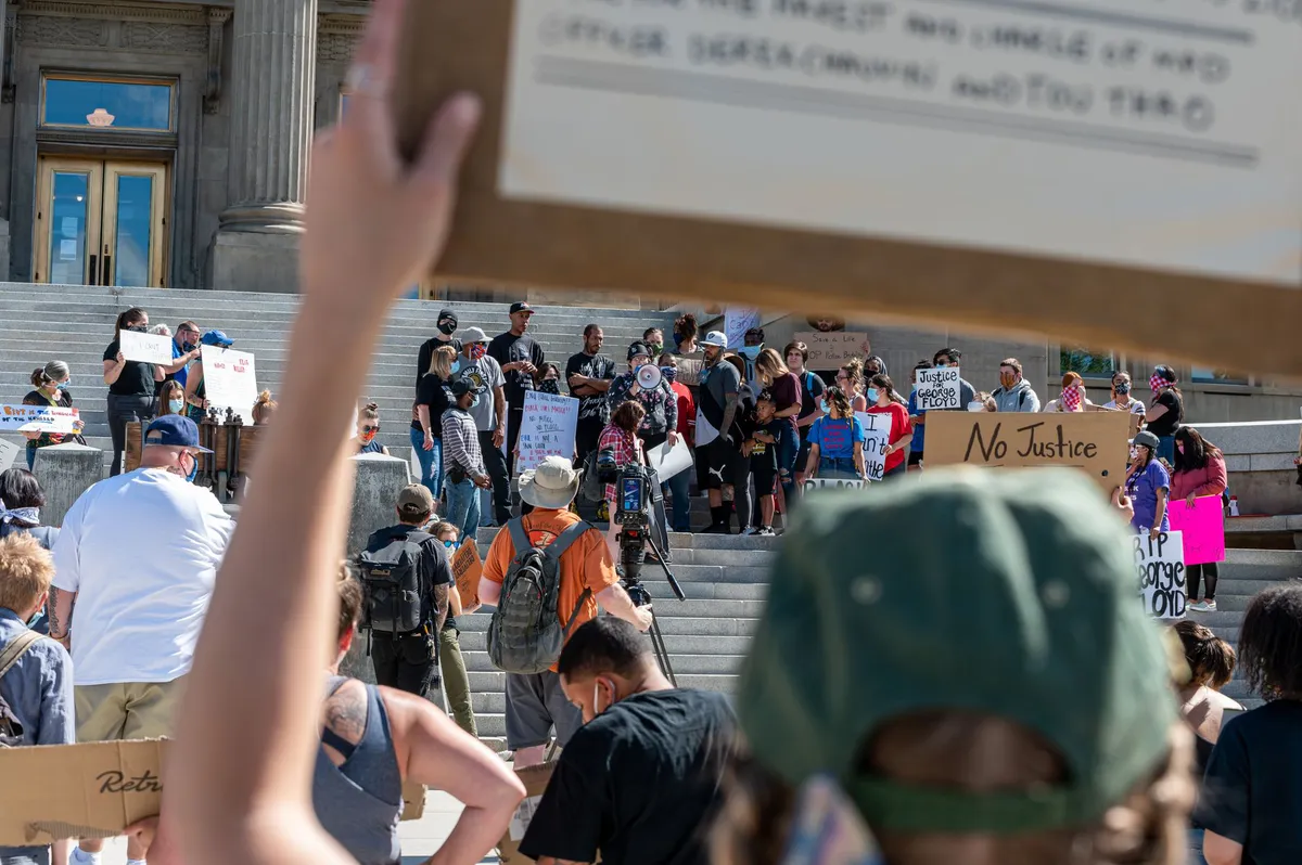 protest signs on Capitol steps