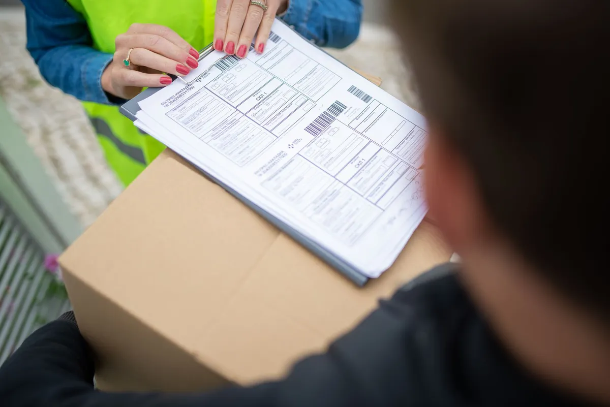 postal worker handling mail