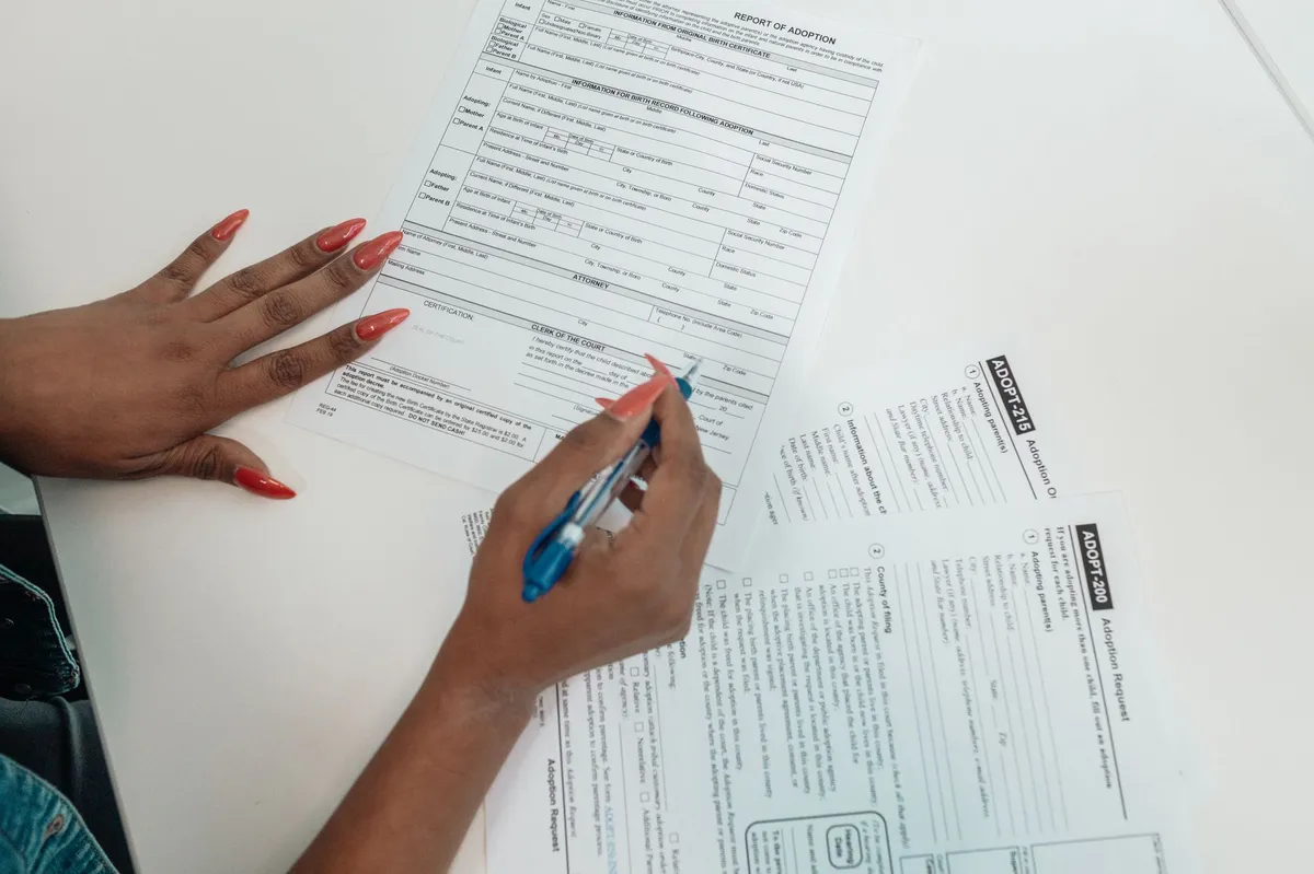 person filling out paperwork