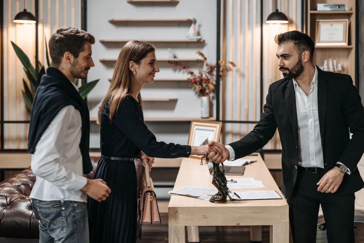 engaged couple meeting with lawyer