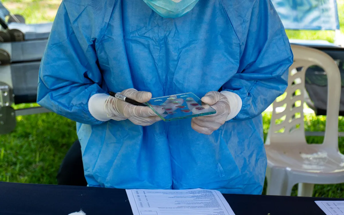 health worker conducting field tests