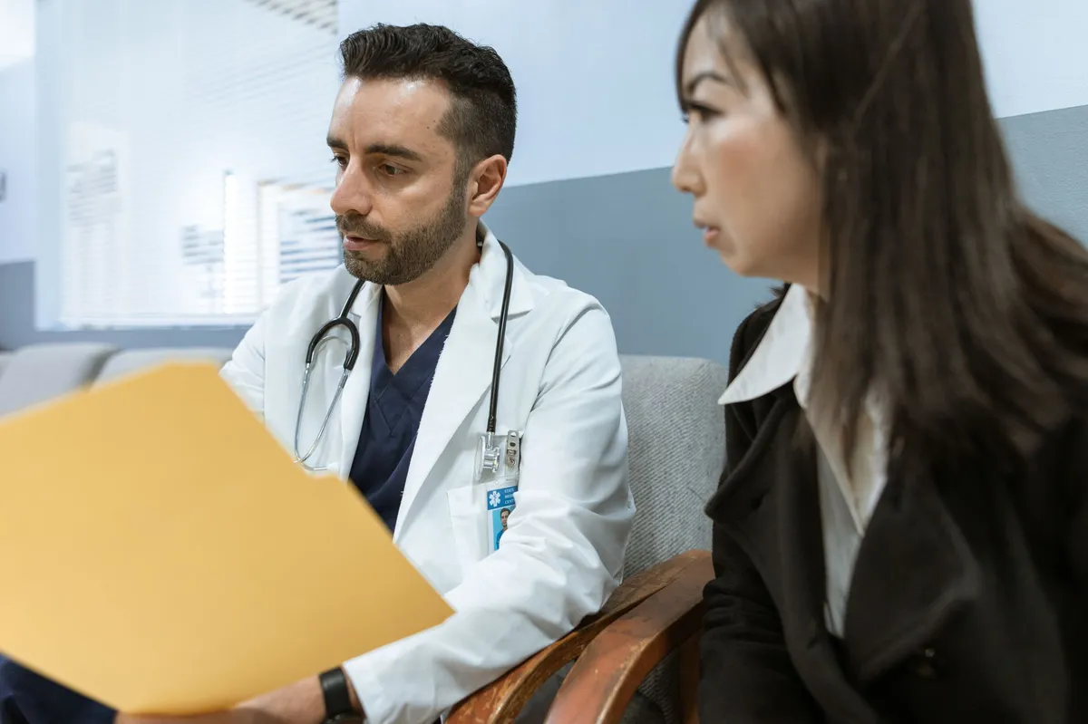 nurse practitioner interacting with patient