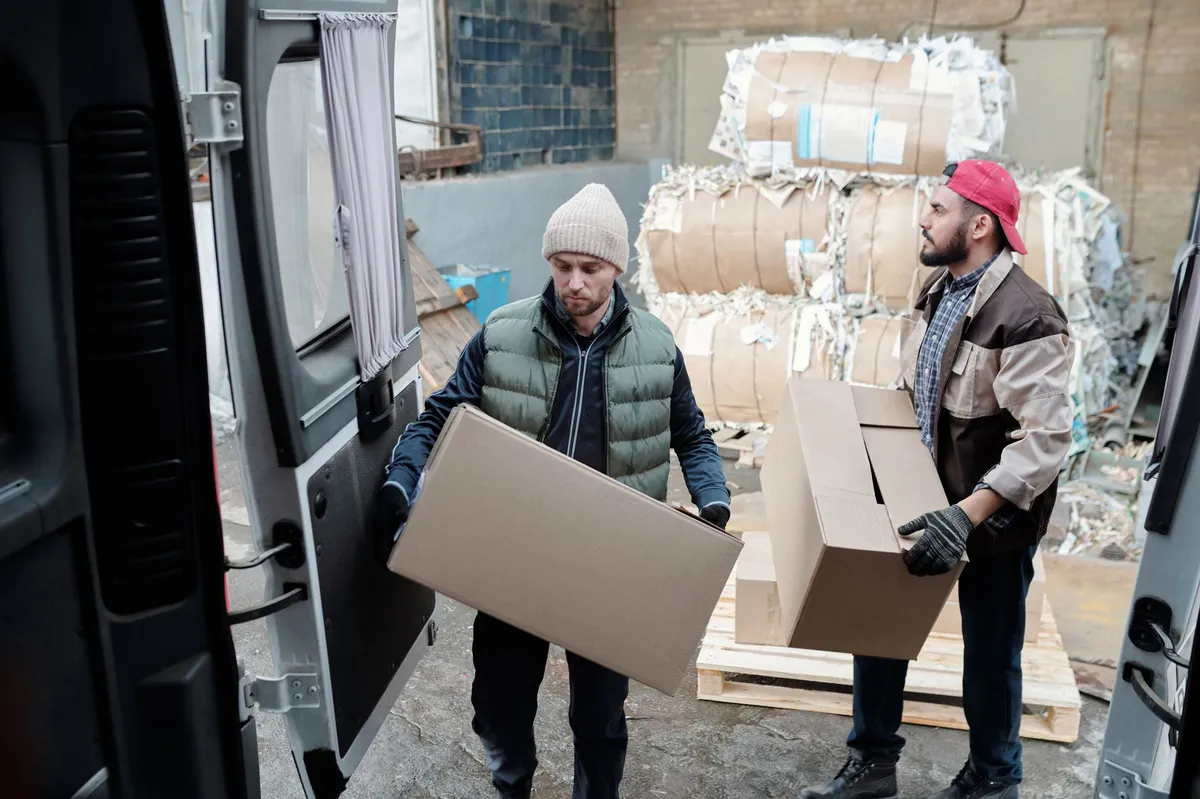 warehouse workers lifting boxes