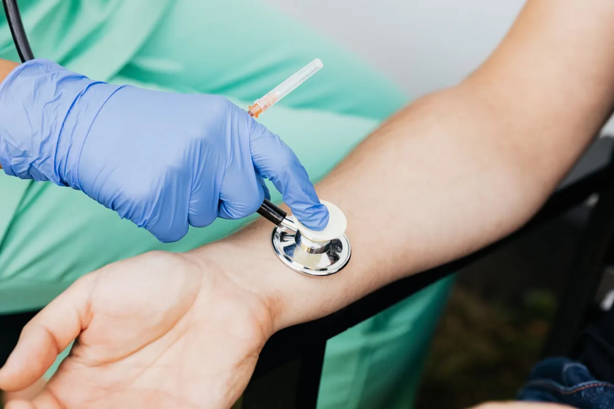 doctor examining patient's wrist