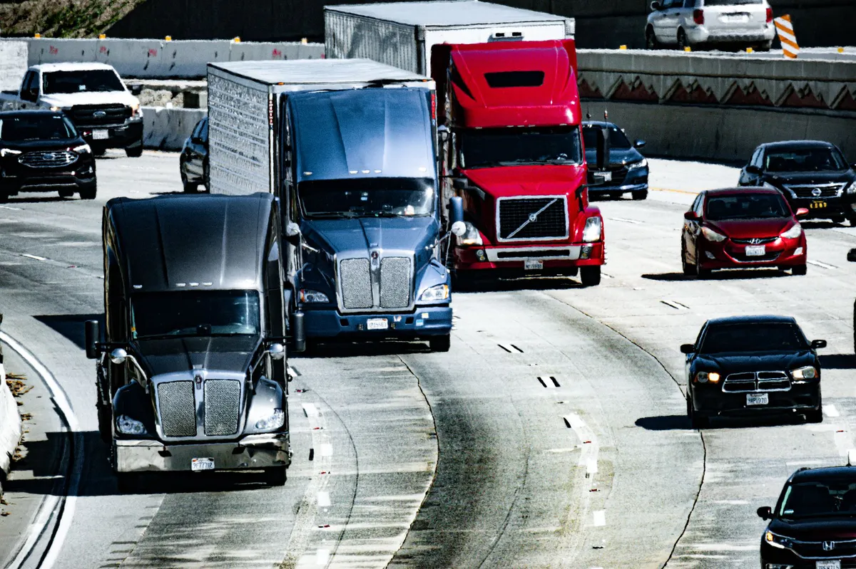 busy Detroit road with trucks