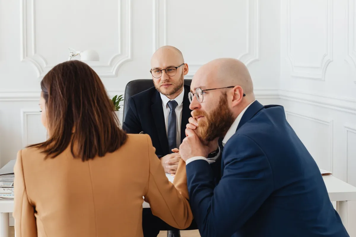 worried client consulting lawyer