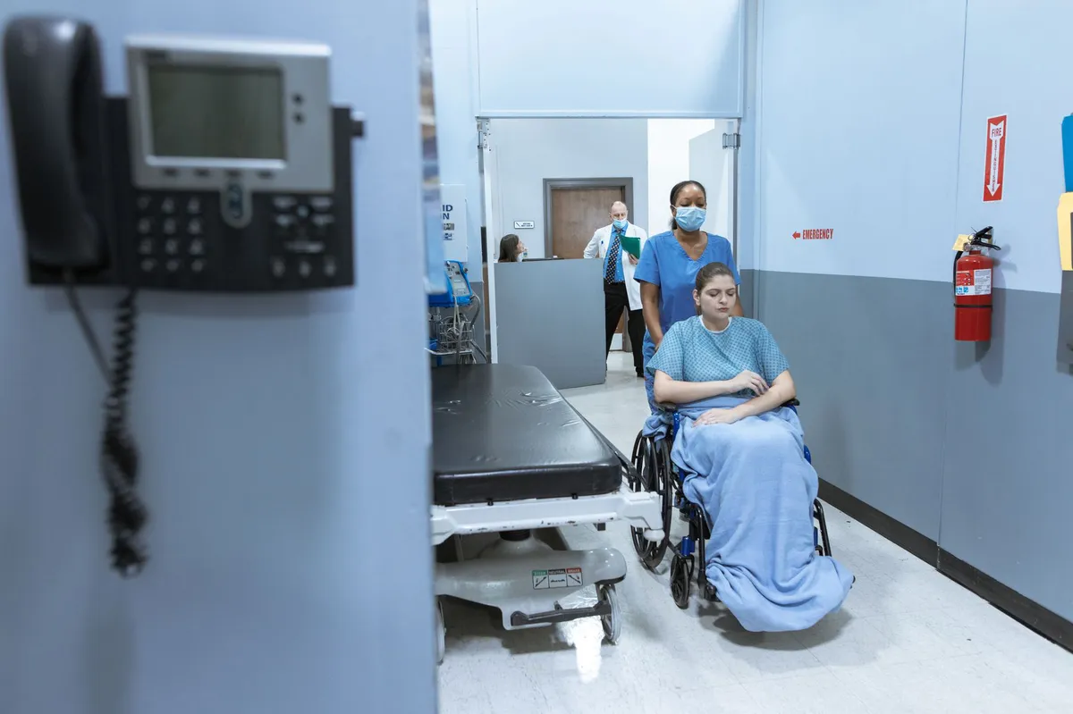 medical staff assisting patient