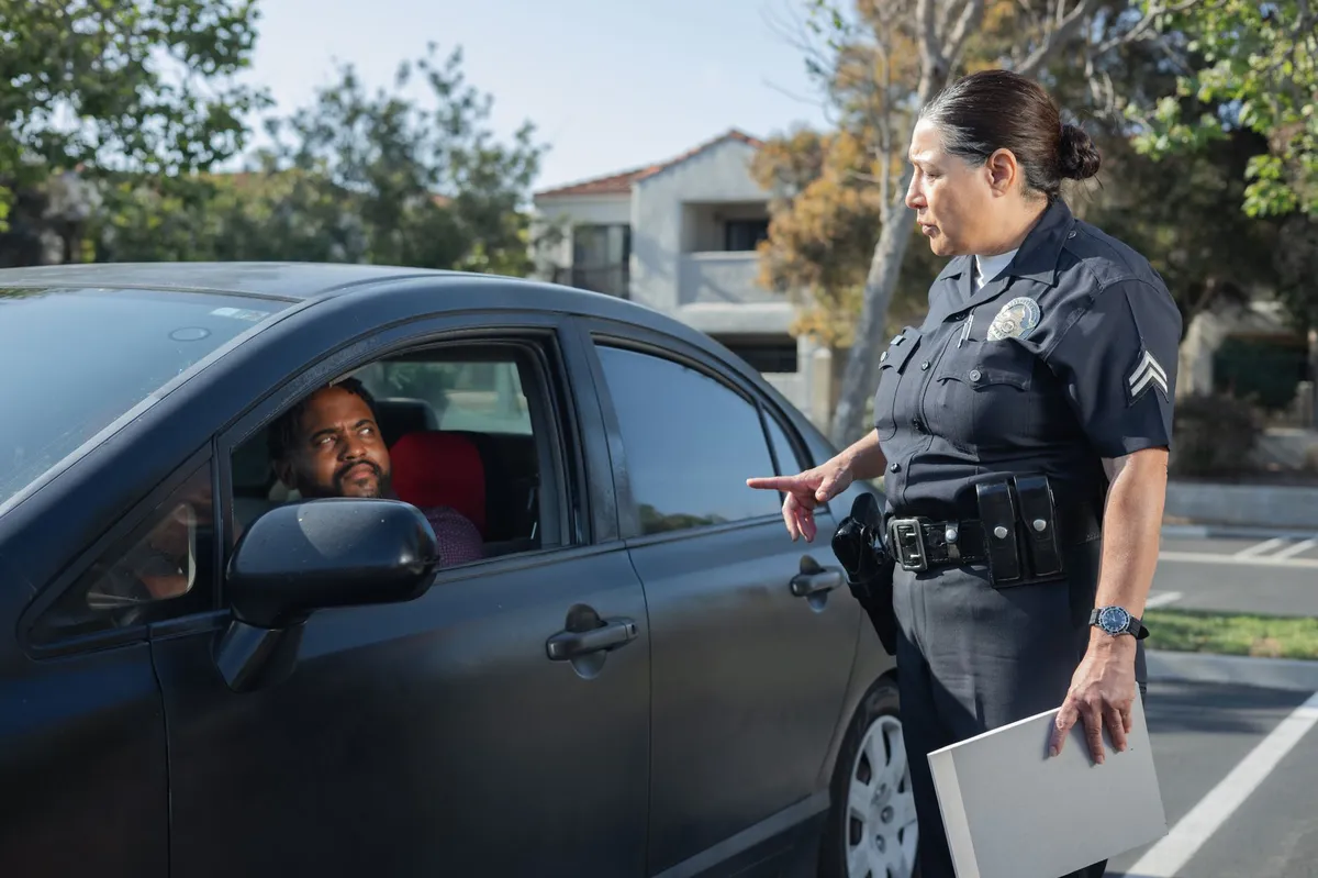 police officer assisting individual