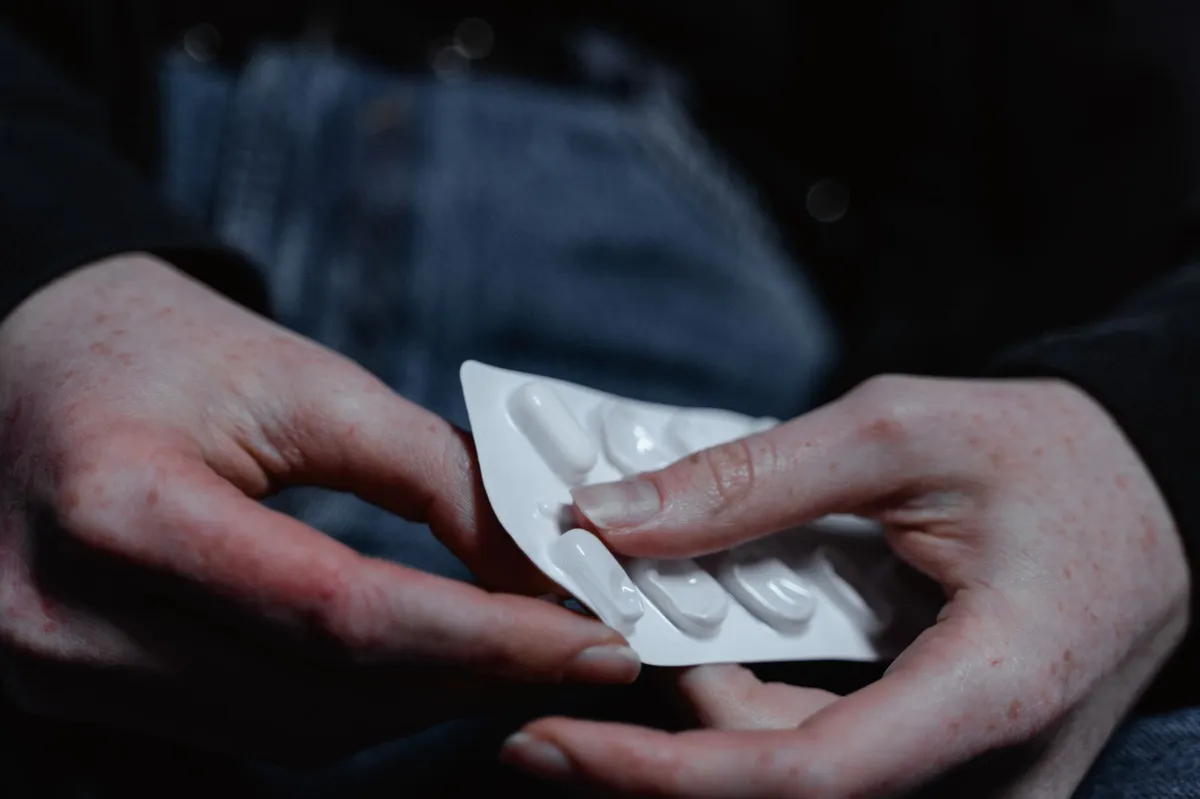 hands holding a prescription