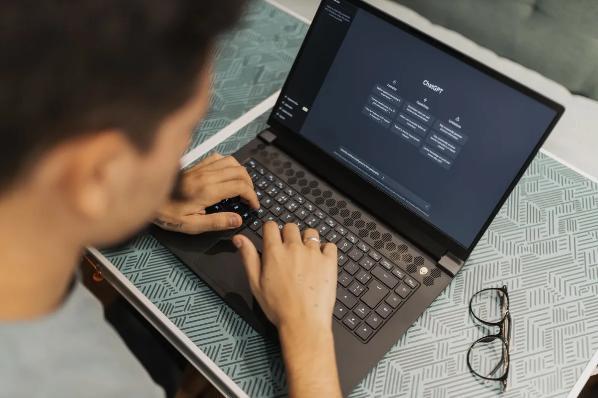 person using laptop with AI software