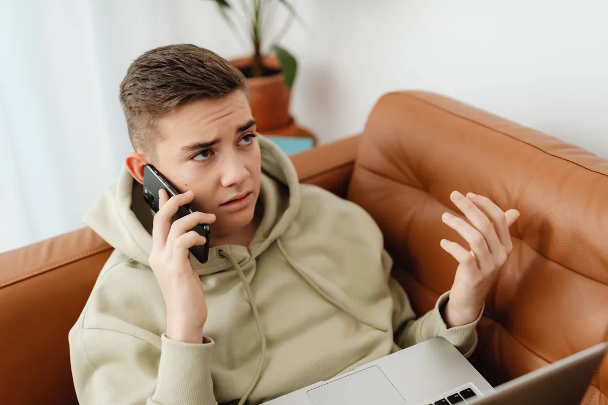 concerned teenager using smartphone