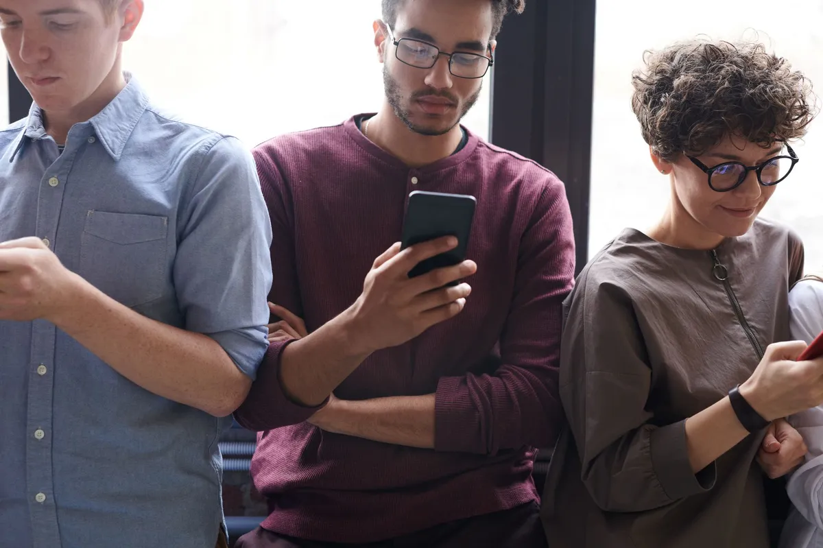 young adults using smartphones
