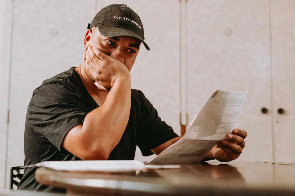 concerned investor reviewing documents