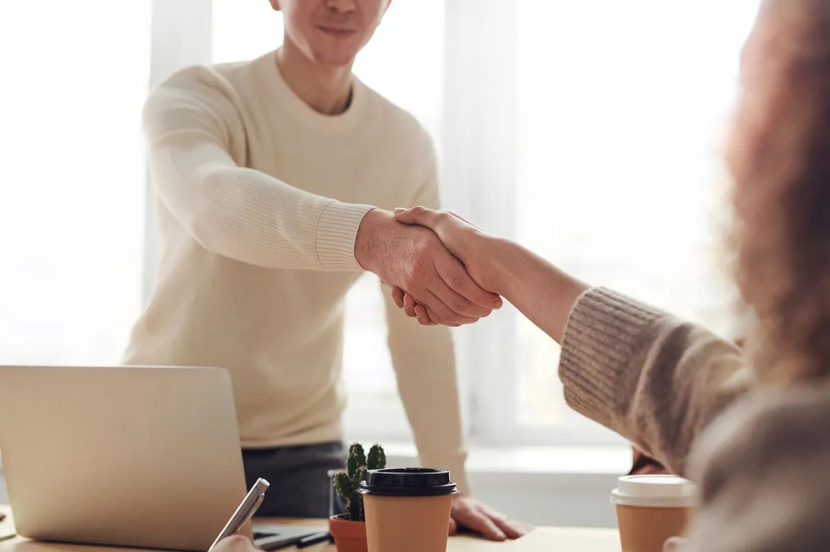 contractor and client shaking hands