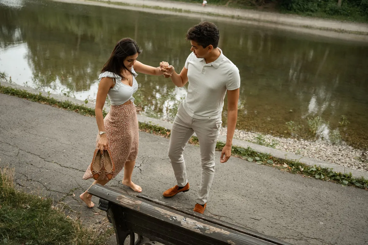 couple holding hands in park