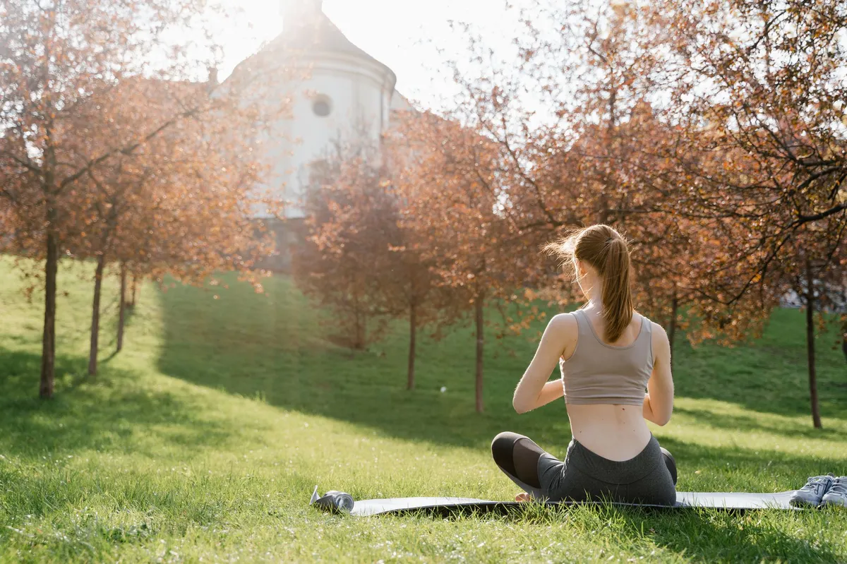 person meditating in nature