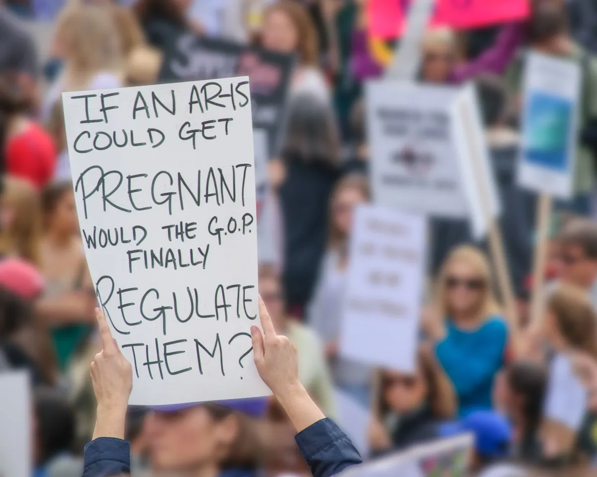 young man with gun rights signs