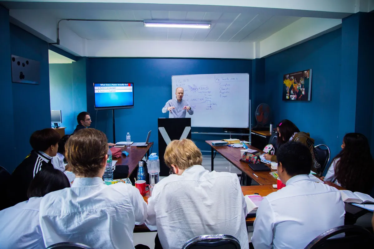 students listening to a panel discussion