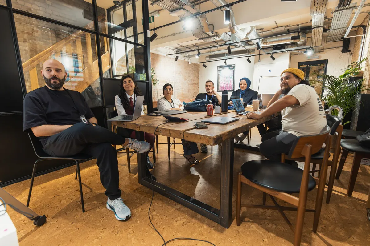 people discussing around table